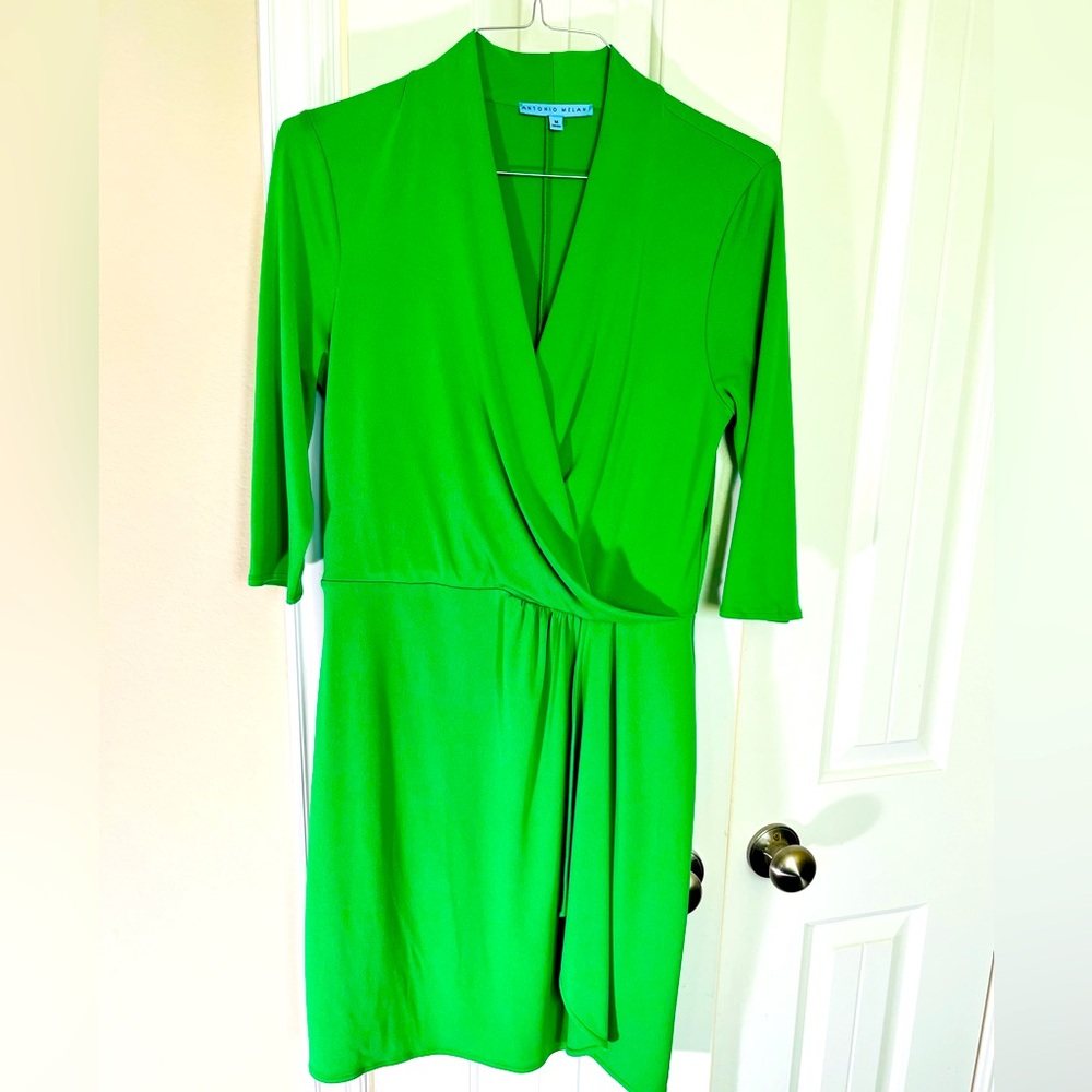 Kelly green wrap around dress with 3/4 length sleeves.
